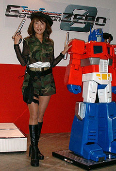 Woman next to Optimus Prime figure