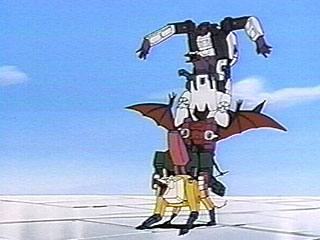 The Decepticon Headmasters stand on top of each other