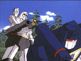 Megatron stands behind Soundwave w/ key in hand