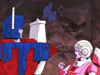 Arcee looks shocked at Ultra Magnus' missile