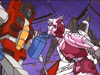 Starscream holds Elita One's chin