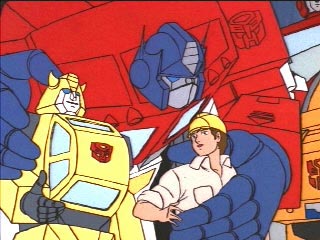 Optimus with arms around Bumblebee and Spike