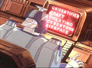 Blurr reads something on his computer monitor