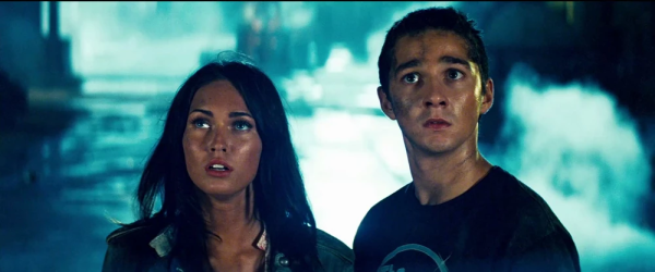 Sam and Mikaela look up at the Autobots