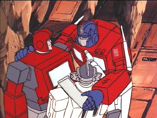 Optimus w/ arms around Autobots