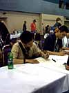 BotCon 2004: Dreamwave Crew - Transformers Event: Pat Lee signing autographs
