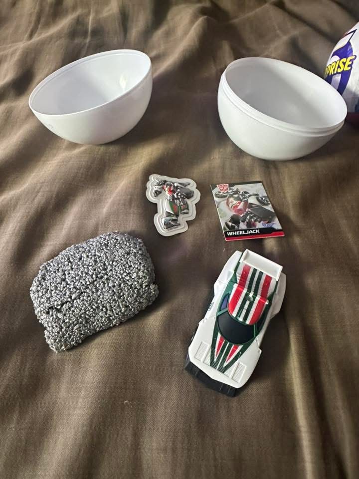 Contents of Zuru Transformers Blind Balls Include Toy, Sticker, Card and Kinetic Sand