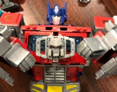 In hand Images of Transformers Power of the Primes Optimus Prime, Rodimus, Starscream and Grimlock