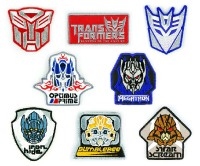 Transformers News: New Images ROTF Badges, Coins, Keychains and more