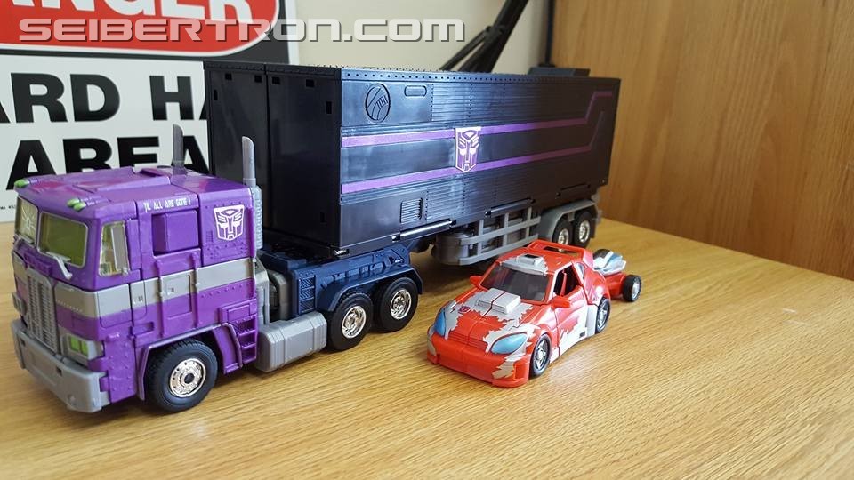 Transformers News: Masterpiece Shattered Glass Optimus Prime Review