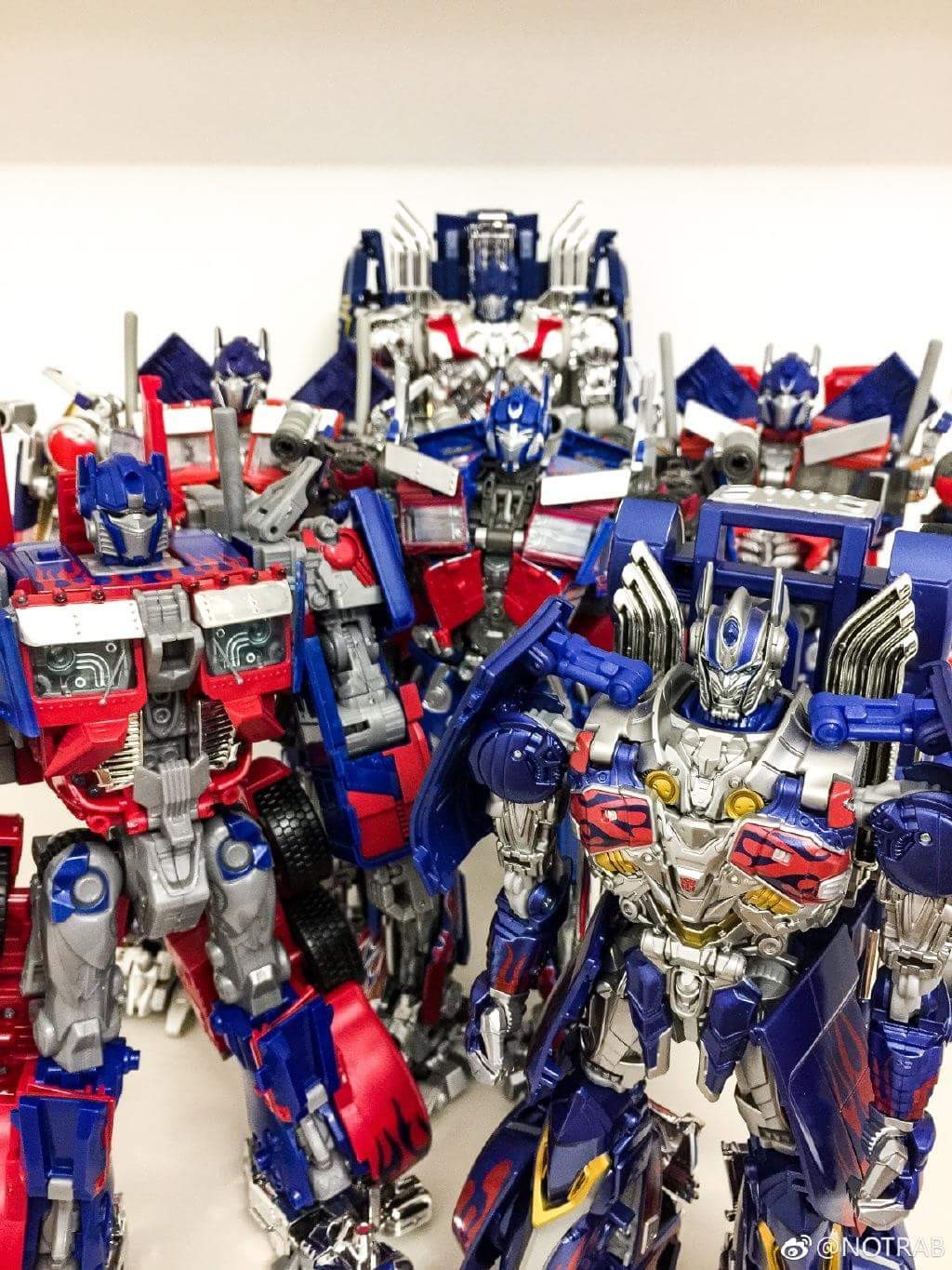 Transformers News: Comparison Shots for Transformers '07 Leader Optimus Prime Re-release, with MPM-4, The Last Knight