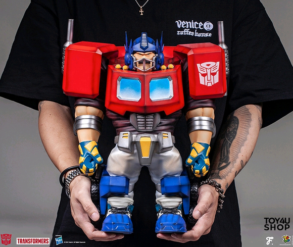 Transformers News: New $400 Statue of Optimus Prime as a Football Player Released Transformers News: New $400 Statue of Optimus Prime as a Football Player Released